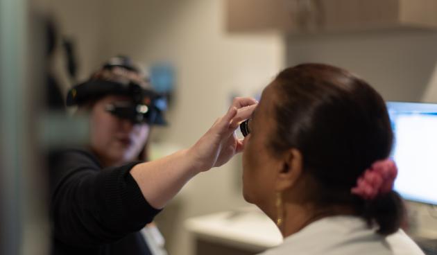 VHP Community Vision Center Optometrist working with a patient