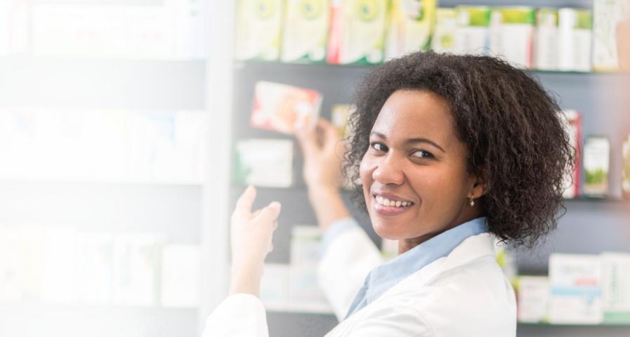 A pharmacist pointing at a medication